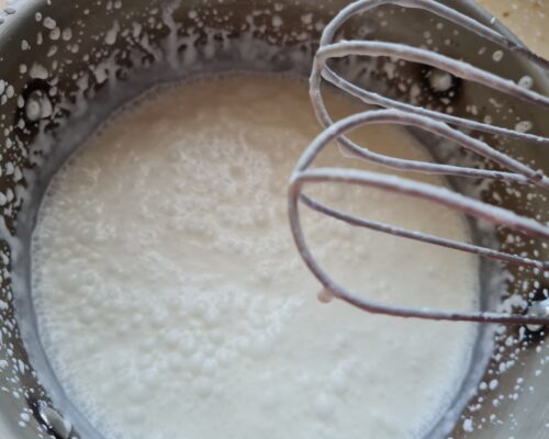 begin to whip the cream with a mixer
