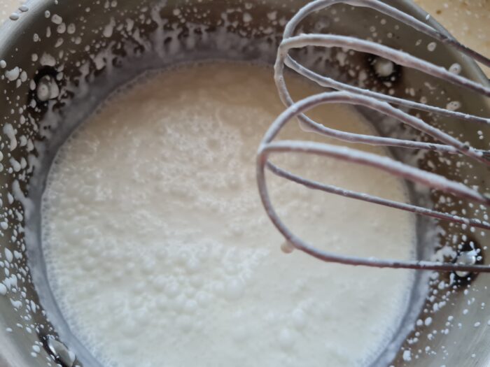 begin to whip the cream with a mixer