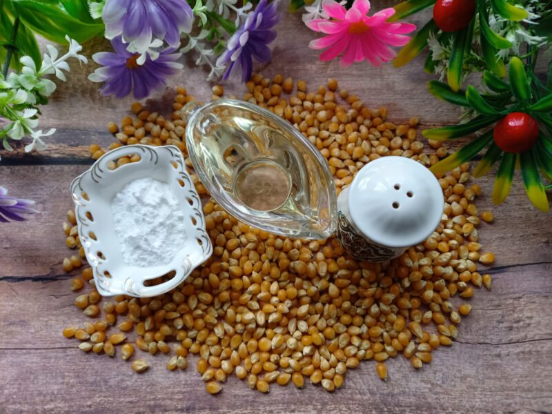 Ingredients laid out: popcorn kernels, oil, salt and sugar