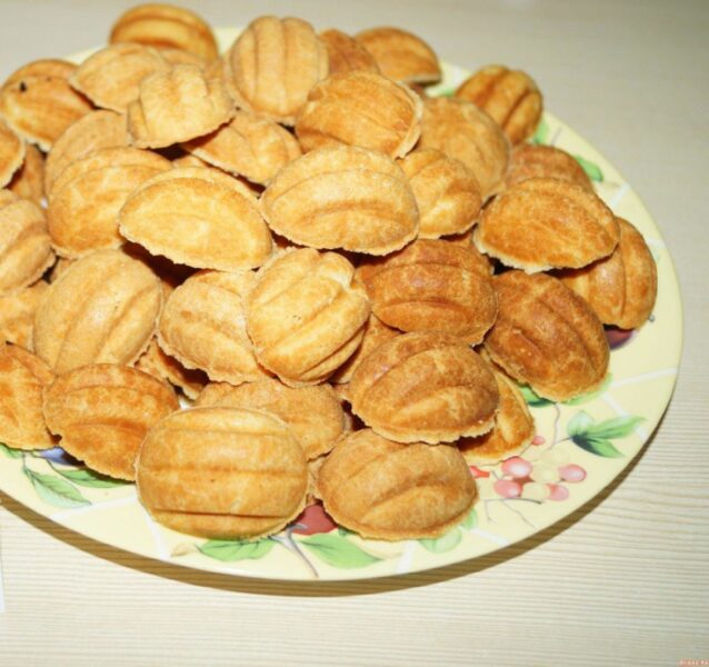 Plate of golden walnut-shaped cookies