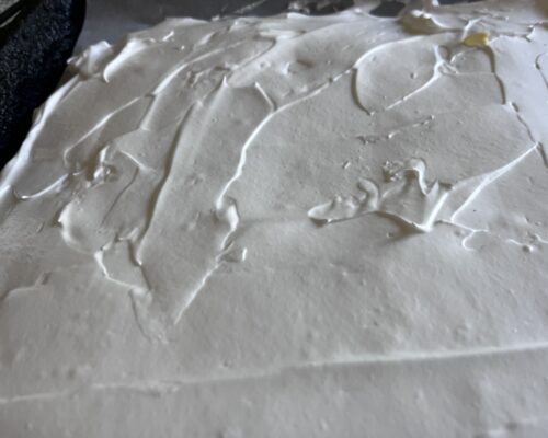 spread the meringue evenly on the tray