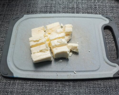 Cut the melted cheese