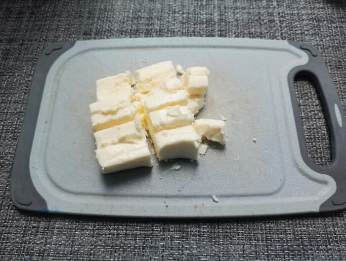 Cut the melted cheese