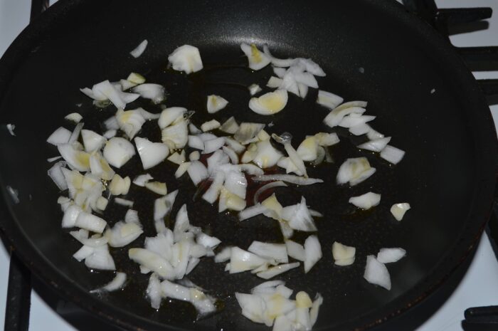 Add the chopped onion and garlic to a pan