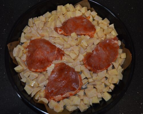 place the potatoes and pork chops on it