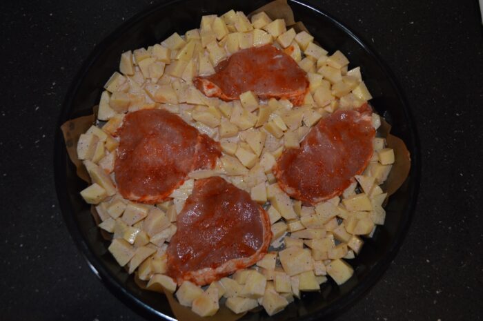 place the potatoes and pork chops on it