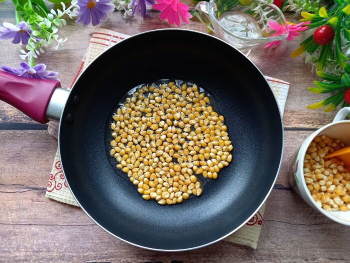 Then add two tablespoons of corn kernels