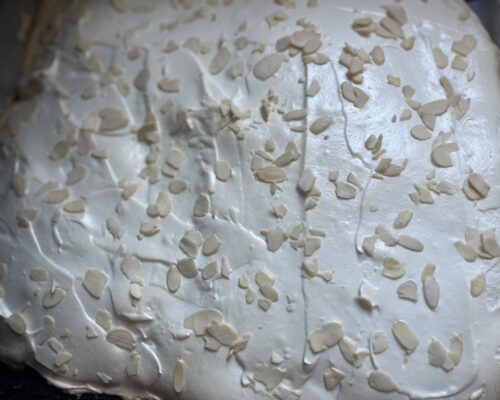 Sprinkle the top generously with almond petals