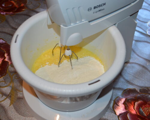 Add the flour mixed with baking powder