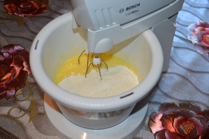 Add the flour mixed with baking powder