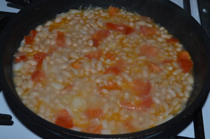 Add the cooked beans to the pan