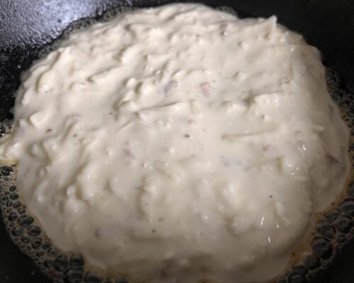 Pour half of the batter onto a hot pan