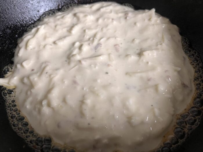 Pour half of the batter onto a hot pan