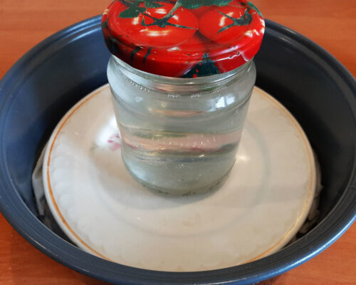 Place a weight on top of the meat