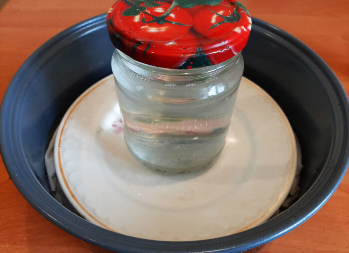 Place a weight on top of the meat