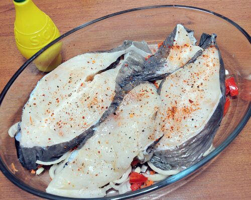 Place the catfish steaks on top of them