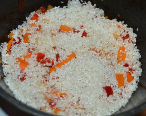 Add the rice to the vegetables