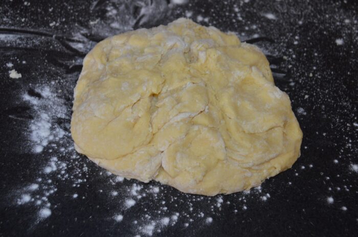 Sprinkle a little flour on the table