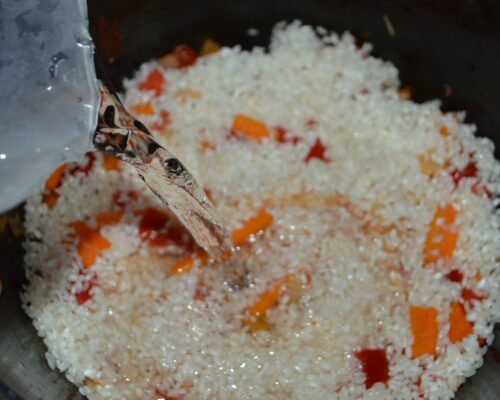 Pour in enough water to cover the rice