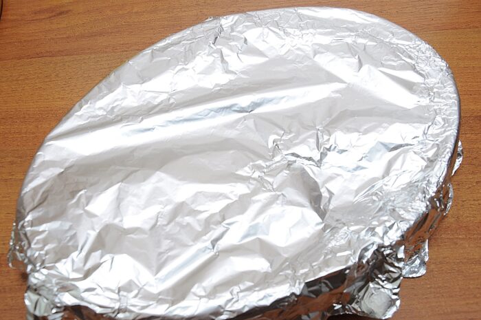 Cover the dish with foil