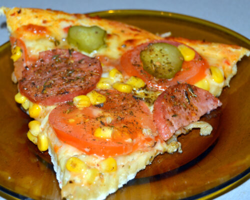 Cut the pizza and serve