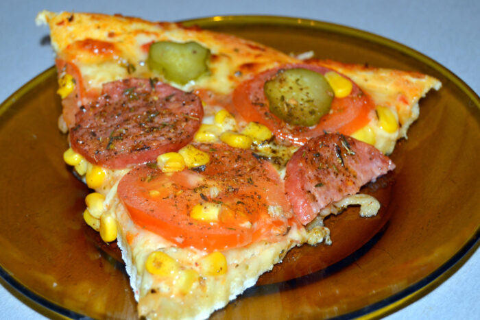 Cut the pizza and serve