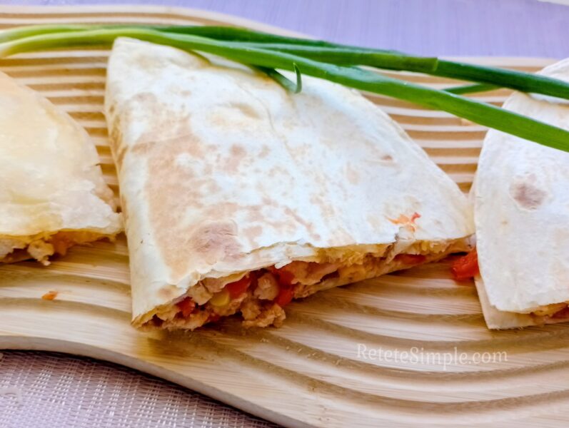 Chicken vegetable burrito wrapped and served on plate