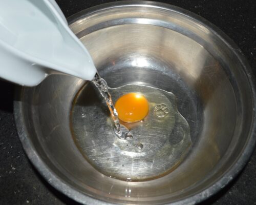 Break an egg into a bowl