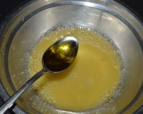 Pour two tablespoons of olive oil