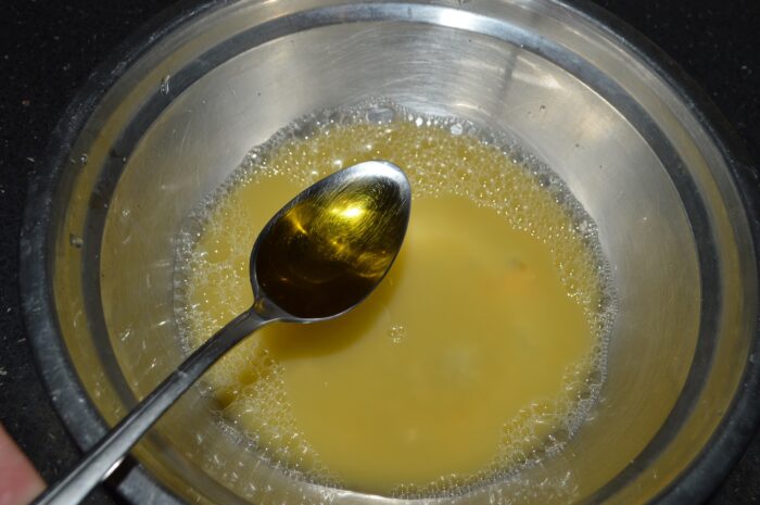 Pour two tablespoons of olive oil