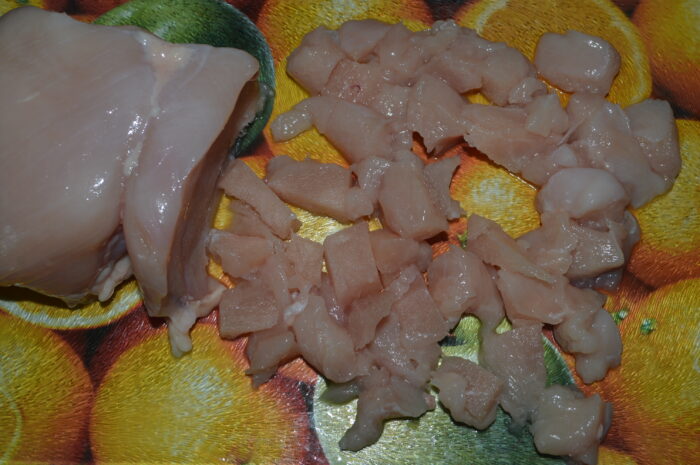 Chop the chicken breast finely
