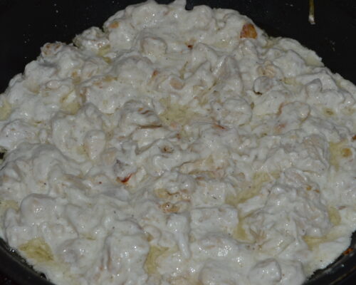 chicken breast in sour cream sauce in the pan