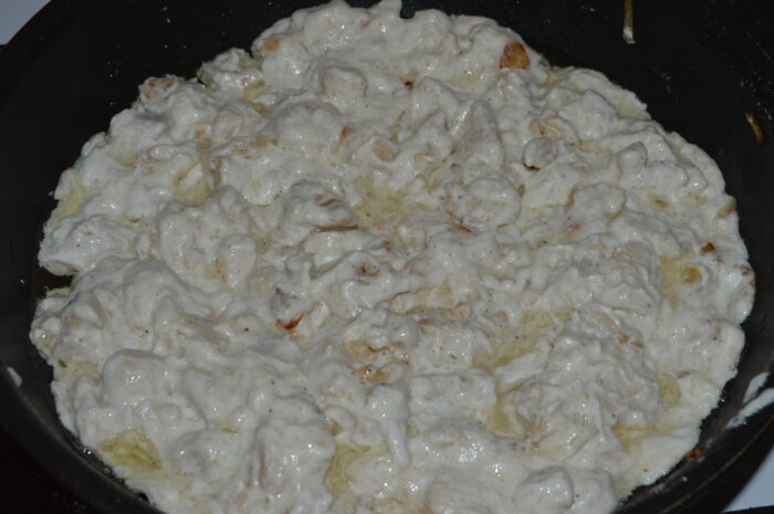 chicken breast in sour cream sauce in the pan