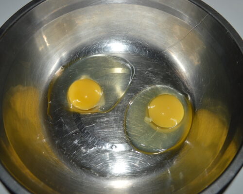 Break the eggs into a bowl