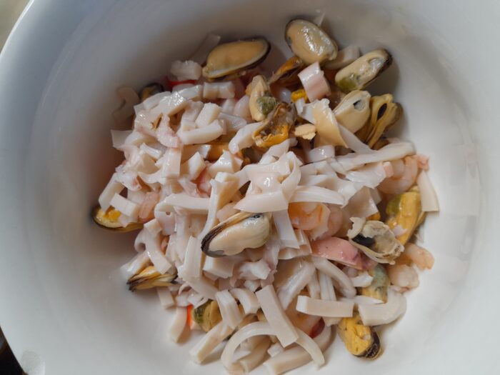 place the prepared seafood in a deep bowl