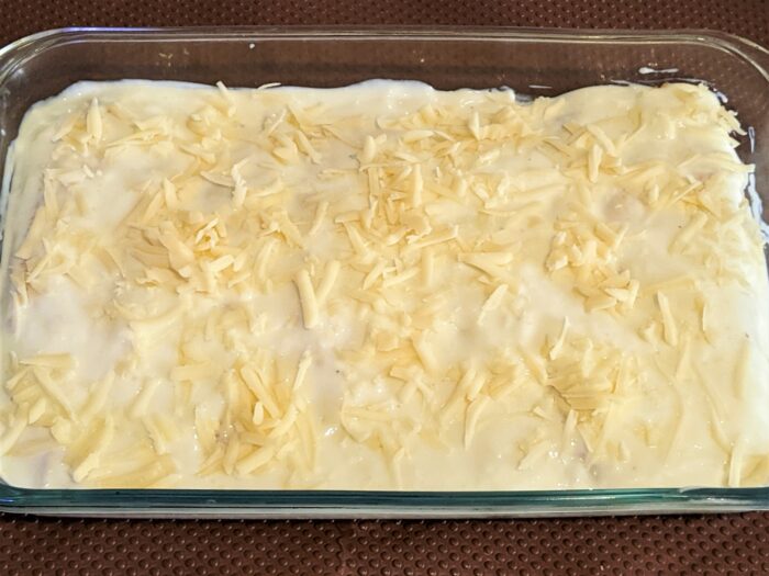 sprinkle grated cheese on top