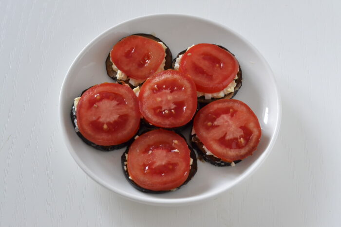 Place a slice of tomato