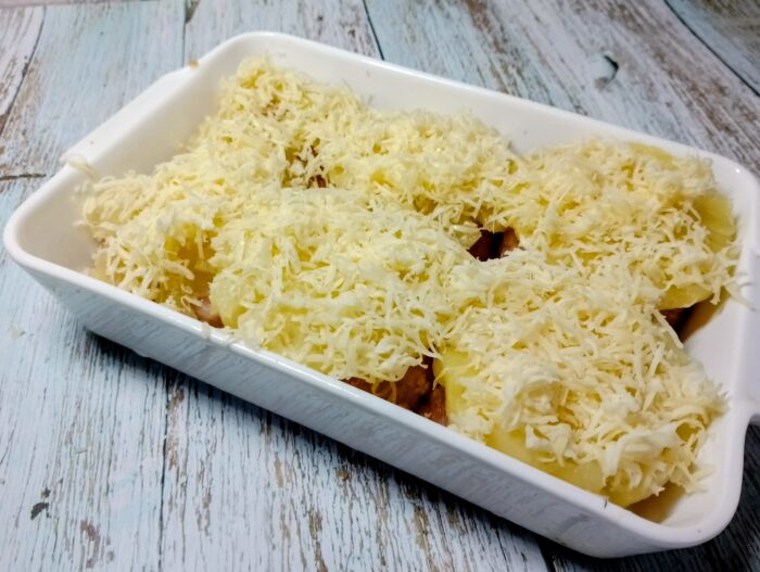 Sprinkle generously with grated cheese