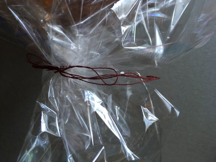 Tie the edges with strong thread