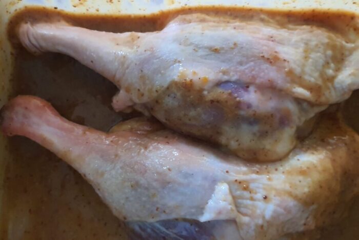 Coat the duck legs in the marinade