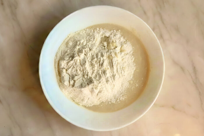 Add the remaining half of the flour