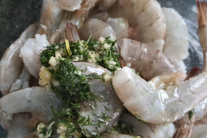 Spoon the dill and garlic mixture over the shrimp