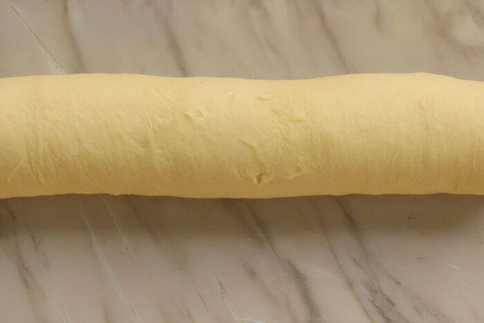 Roll the dough up into a log